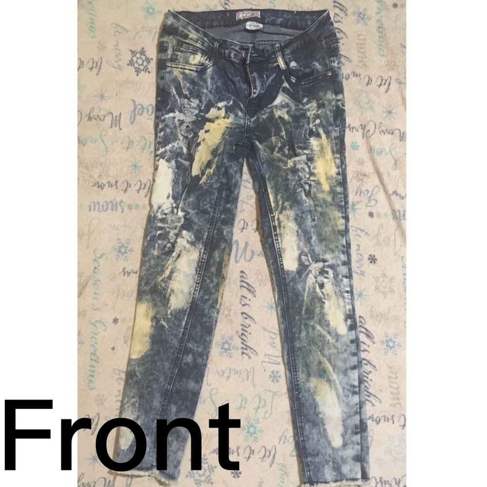 Distressed dark blue faded jeans